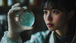 © Jhati - Young scientist observing microbial growth in petri dish at laboratory