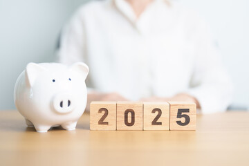 Wall Mural - Happy New Year 2025 with piggy bank. Resolution, Goals, Plan, Action, Money Saving, Retirement fund, Pension, Investment and Financial concept