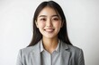© Ganesha88 - Young Japanese woman in business casual attire, smiling and looking directly at the camera with confidence against  Portrait of a professional office worker  confident young entrepreneur on isolated