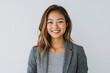 © Ganesha88 - Young Japanese woman in business casual attire, smiling and looking directly at the camera with confidence against  Portrait of a professional office worker  confident young entrepreneur on isolated