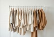 © BiVn - .Clothing rack with neutral colored shirts