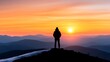 © nuiiko - Travel adventure accommodation concept.  A silhouette of a person stands atop a mountain, gazing at a vibrant sunrise over rolling hills.