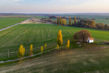 Poster - Landscape on fields at sunset with chapel, aerial view