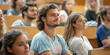 © agrus_aiart - Group of students listening to lecture in lecture hall