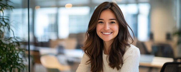 Poster - Cheerful businesswoman smiling in modern office space professional photo bright environment inspirational concept