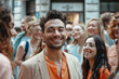 © standret - Smiling man in a crowd expressing joy and togetherness outdoors