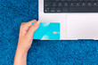 © ADDICTIVE STOCK - Online shopping at home with laptop and credit card