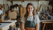 © standret - Young female cabinetmaker smiling in her workshop