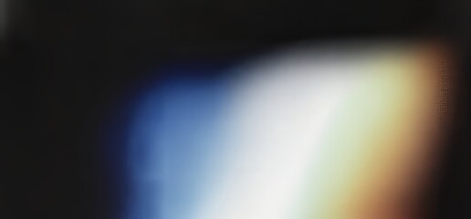 Fototapete - A dark banner design featuring a grainy gradient background with abstract waves of blue, yellow, and red, highlighted by a glowing, vibrant texture against a black backdrop.