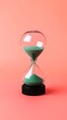 © Jacob Lund - Classic hourglass with emerald sand and black base, isolated on a rich coral-pink background