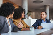© Dragana Gordic - Professional Business Meeting Discussion in Modern Office Setting