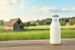 © Kiangdeb - Farm fresh milk in a bottle set against a serene countryside landscape