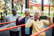 © Marko Geber - Senior friends taking a selfie after a group workout at an outdoor park