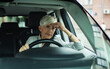 © Davor - Thoughtful senior woman sitting behind the wheel of her car