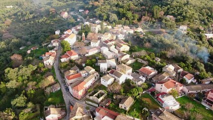 Wall Mural - A small village with a few houses and a few trees