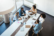 © Dragana Gordic - Diverse Team Collaborating in Modern Office Setting