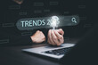 © Bussarin - Businessman using laptop computer search 2025 trends,happy new year concept digital trends,industry and business trend of world full modernity advanced technology,artificial intelligence or AI,banner