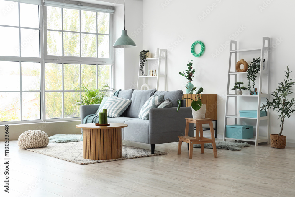 Comfortable sofa and coffee table in interior of living room