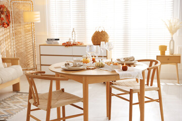 Poster - Stylish table setting with beautiful dishware and autumn decor in dining room
