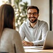© Mr.Minimal - Smiling Recruiter Conducting Job Interview with Candidate in Office