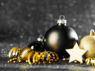 Wall Mural - Christmas balls on black glitter background