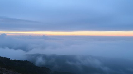 Wall Mural - Early morning mist creates an ethereal atmosphere between the rugged ridges of the mountain, picturesque, outdoors