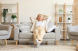 © Pixel-Shot - Old woman resting on sofa at home