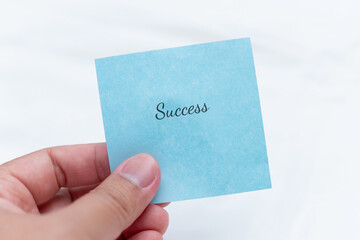 Aufkleber - Inspirational reflection a hand holding a success note in a minimalist setting for motivation and growth