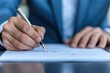 © Tonton1541 - business professional signing important documents concept. Businessman signing document with a silver pen.