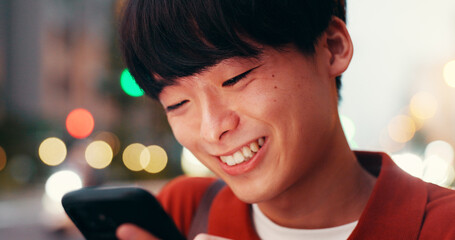 Happy, phone and Asian man in city for social media, online message and internet in evening. Travel, networking and person on smartphone for website, notification and mobile app on weekend in Japan
