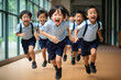 © Evon J - Joyful Asian Schoolchildren Running in Hallway