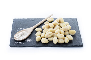 Tasty raw gnocchi isolated on white background