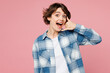 © ViDi Studio - Young happy surprised shocked woman wearing blue shirt white t-shirt casual clothes doing phone gesture like says call me back isolated on plain pastel light pink background studio. Lifestyle concept.