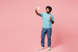 © ViDi Studio - Full body young Indian man wear blue t-shirt casual clothes do mobile cell phone selfie shot post photo on social network show v-sign isolated on plain pastel light pink background. Lifestyle concept.