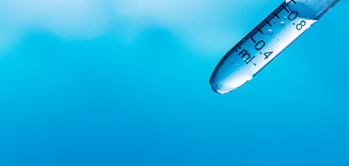 Wall Mural - close-up blue science experiment background,the sciences experiment in blue background