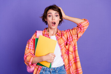 Wall Mural - Photo of nice young girl hold supply open mouth wear shirt isolated on violet color background