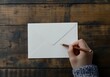 © Khmel - Writing a letter on a wooden table with a pencil