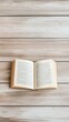 © olegganko - Open book resting on a wooden surface in a cozy reading nook during daylight hours