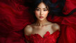 © namoi - Attractive Asian woman in a glamorous red dress, posing confidently with a graceful demeanor, perfect for a fashion portrait