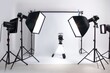 © Alla - A professional photography studio setup with a white backdrop and lighting equipment