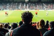 © Larisa - Curly-haired spectator at rugby game, crowd watching
