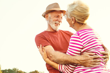 Wall Mural - woman man outdoor senior couple happy lifestyle retirement together smiling love old nature mature e