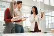 © K Davis/peopleimages.com - Collaboration, discussion and model with architect people in office together for building or construction. Blueprints, explain or project management with man and woman property developer team at work