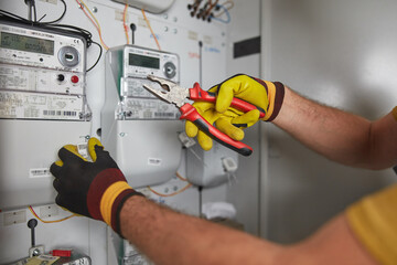 Wall Mural - Technician working on a modern electricity power meter station.