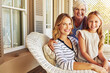 © peopleimages.com - Girl, grandmother and mother by house for bonding, relax and love with support, care or happiness. Young child, grandma and mom as family in portrait for generations, babysitting or weekend in Poland