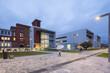 © ADDICTIVE STOCK - Modern hospital center with contemporary architecture at dusk