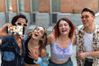© ADDICTIVE STOCK - Four friends enjoying a moment together taking a selfie