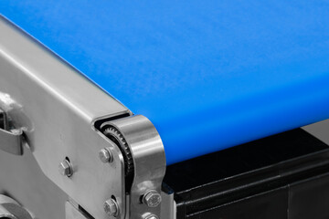 Poster - A blue conveyor belt with a silver frame. The belt is on a machine
