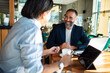 © Marko Geber - Middle-aged businessman having a coffee meeting in a stylish cafe