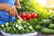 © Konstiantyn Zap - Woman preparing fresh vegetable salad with cucumbers, tomatoes, and lettuce
